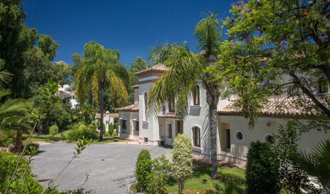 Facade of the villa and green garden