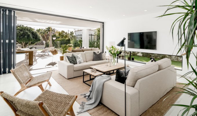 Living room with fireplace and TV set