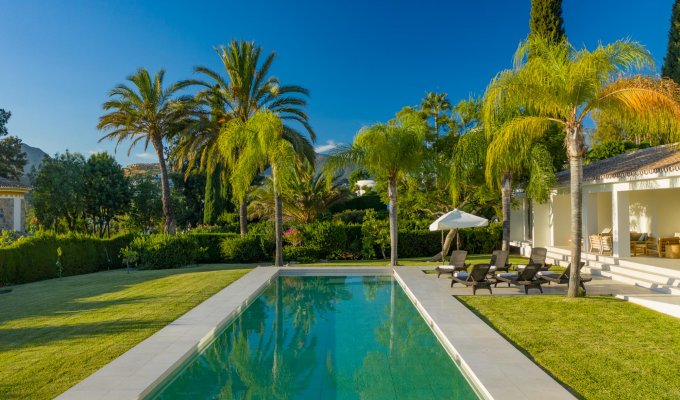 Large pool and wooded garden