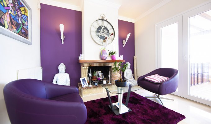 Finely redecorated living room with fireplace