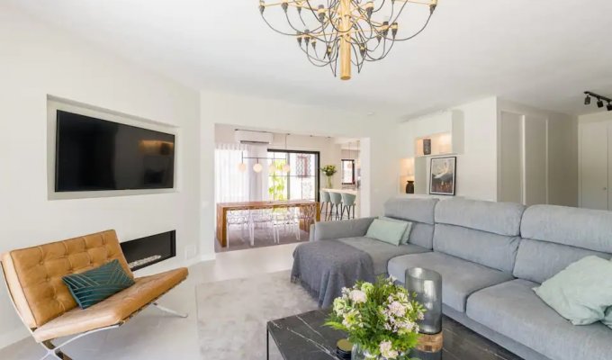 Refurnished TV room with fireplace 