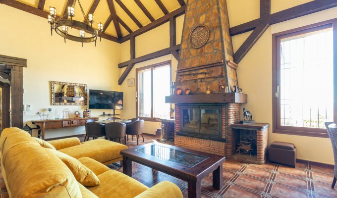 Living room with fireplace and TV set