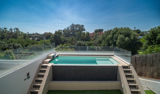 Secured pool with a glass