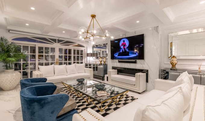 Living room next to indoor pool