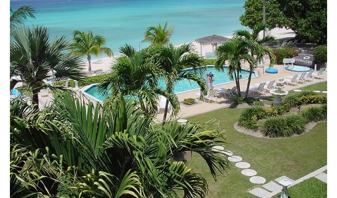 A 21-unit oceanfront condo hotel directly on Seven Mile Beach Grand Cayman