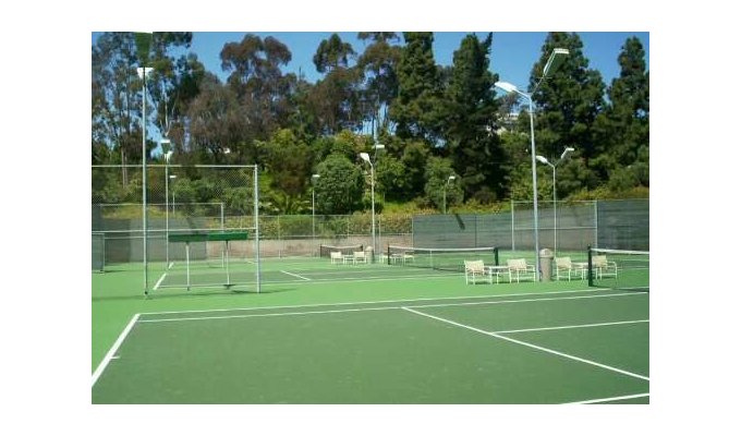 Three Lit Tennis Courts by the Pool