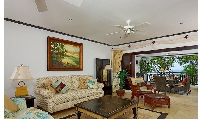 Barbados luxury condo vacation rentals beachfront apartment private terrace sea views and Jacuzzi pool.
