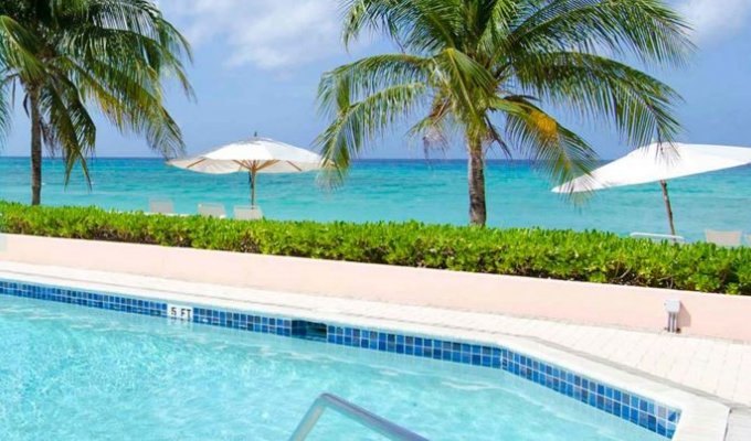 A 21-unit oceanfront condo hotel directly on Seven Mile Beach Grand Cayman